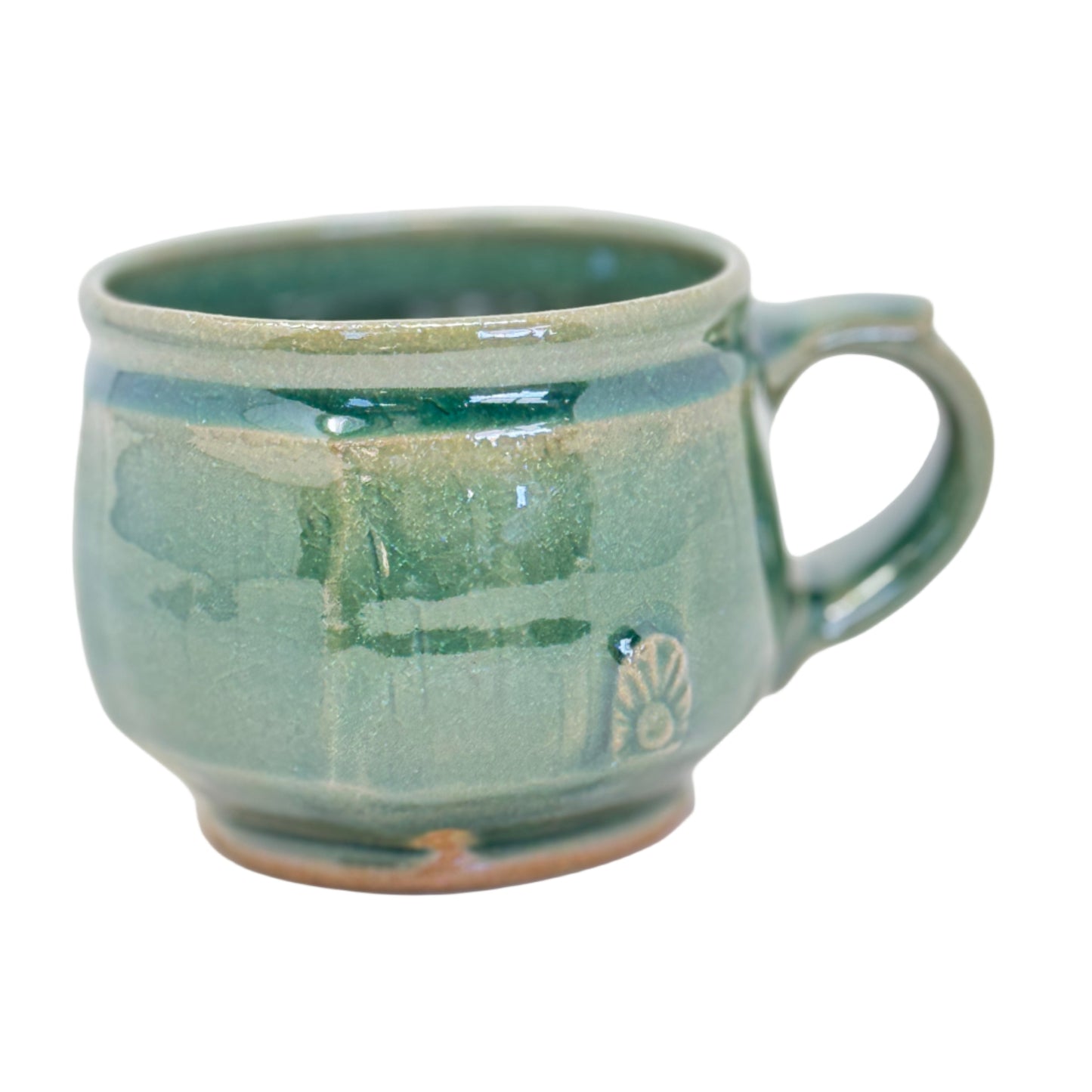 Green ceramic mug on a white background