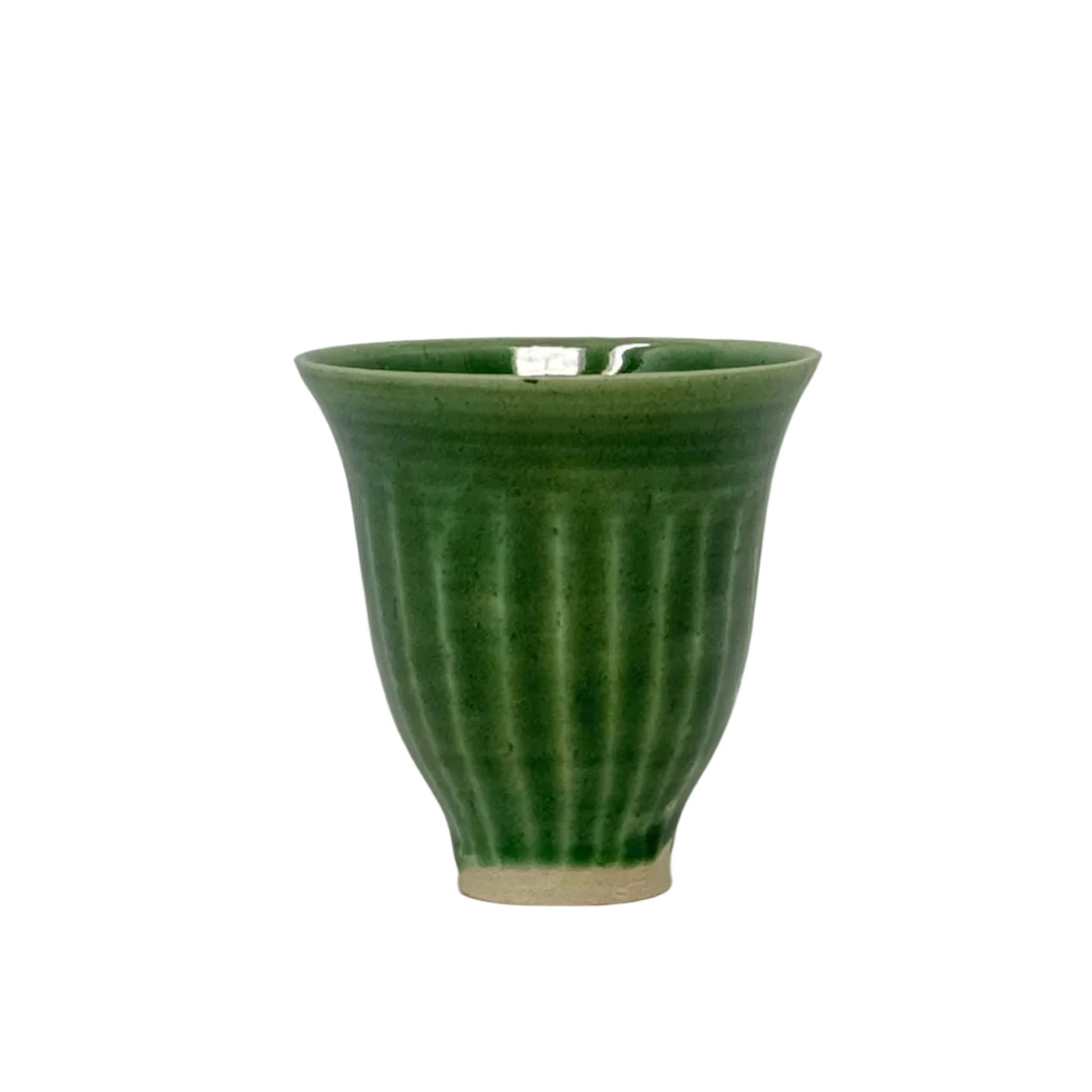 Green ceramic cup with ribbed texture on a white background