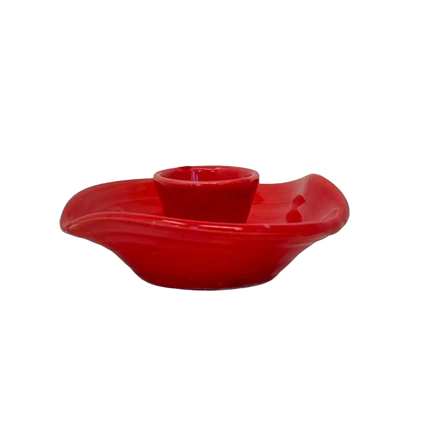Red ceramic candle holder on a white background