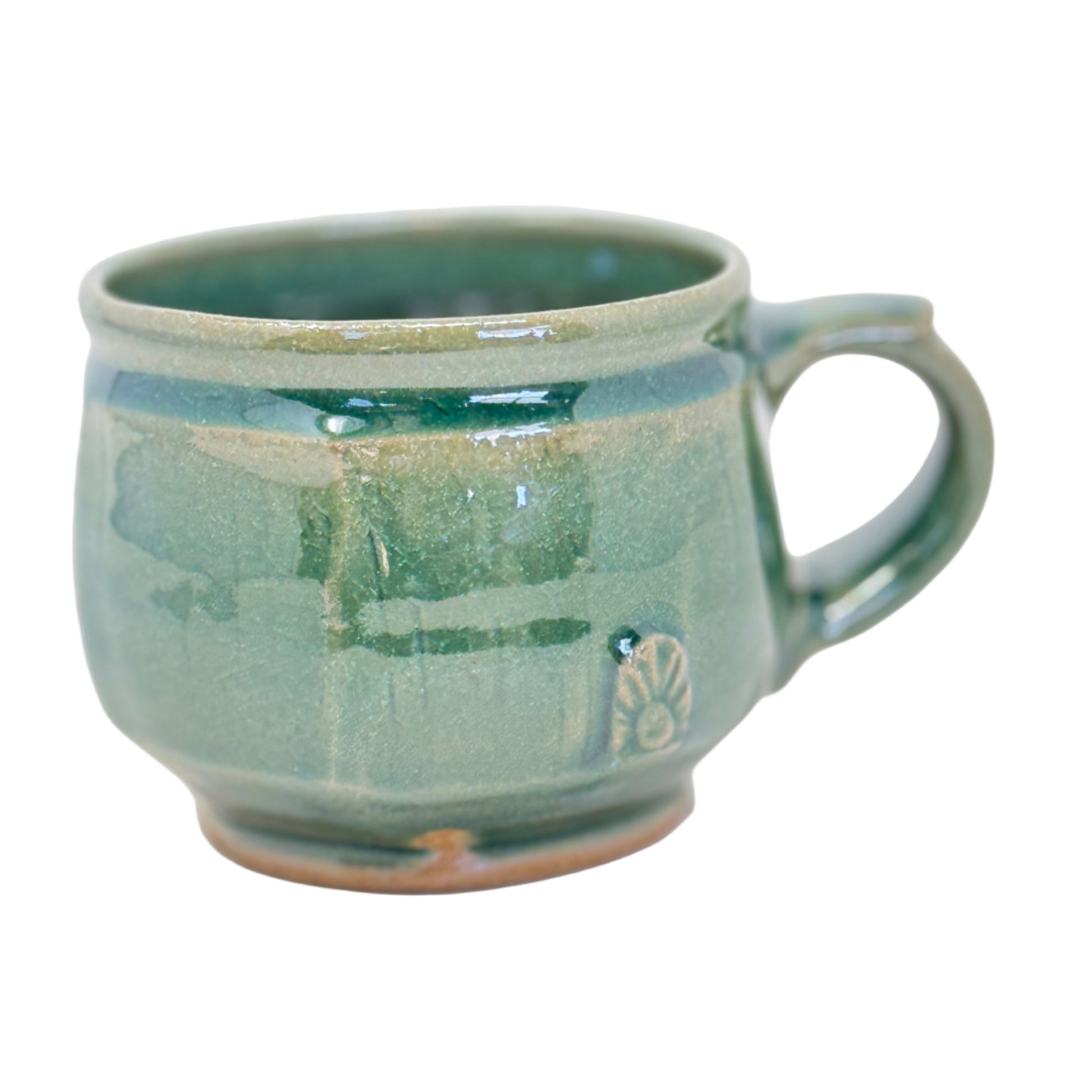 Green ceramic mug on a white background