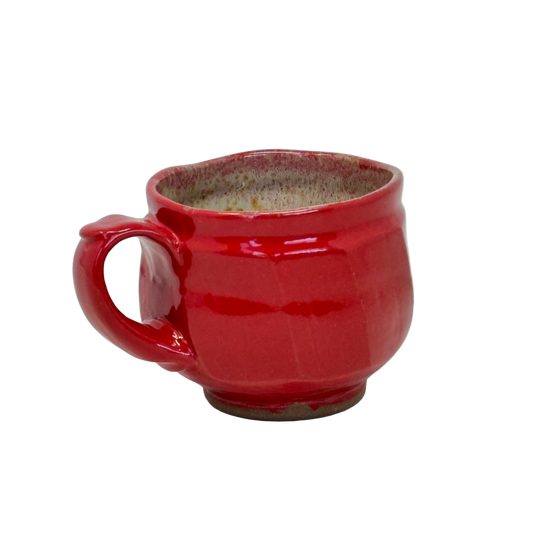Red ceramic mug on a white background