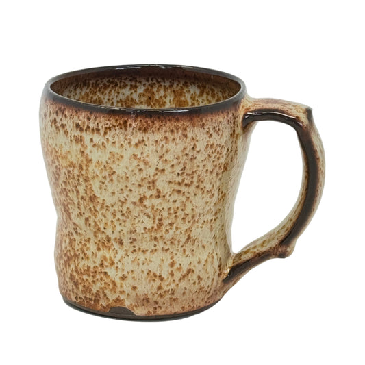 Speckled brown ceramic mug on a white background