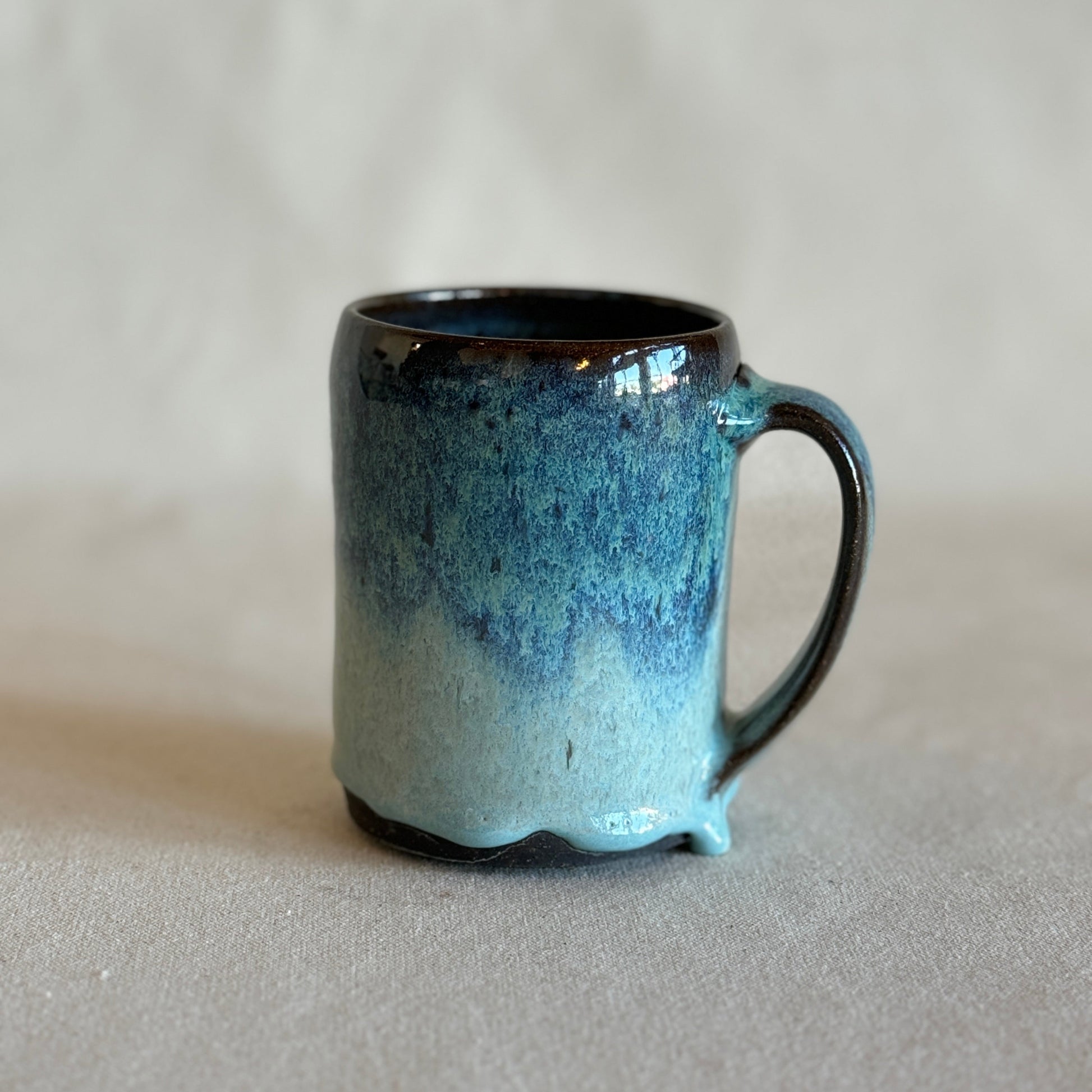 Blue ceramic mug on a plain background