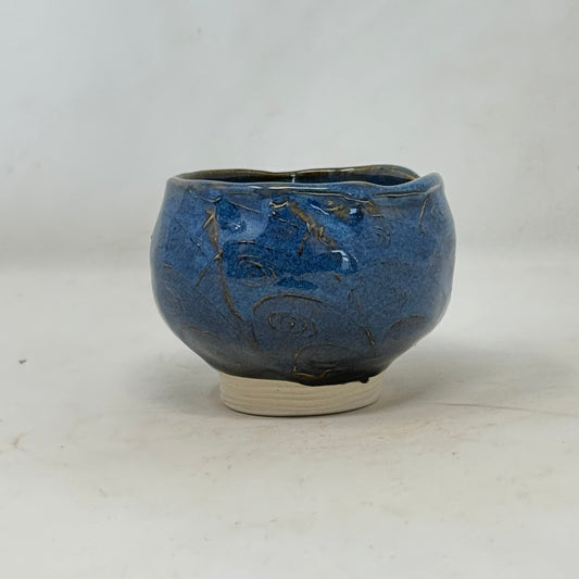 Blue ceramic bowl on a white background