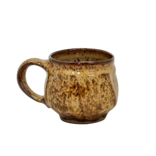 Brown ceramic mug on a white background