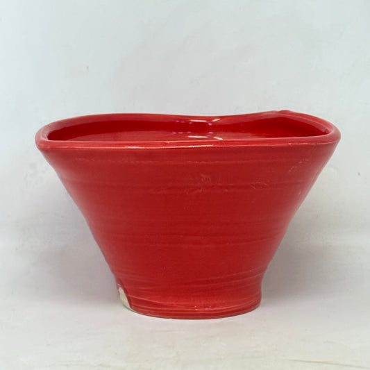 Red ceramic bowl on a white background