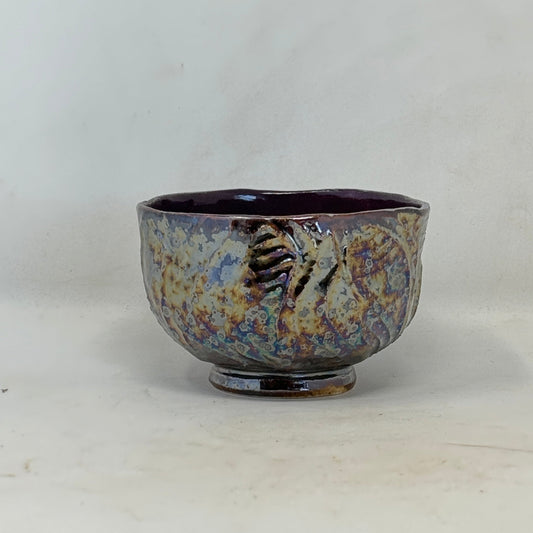 ceramic bowl with intricate pattern on a white background