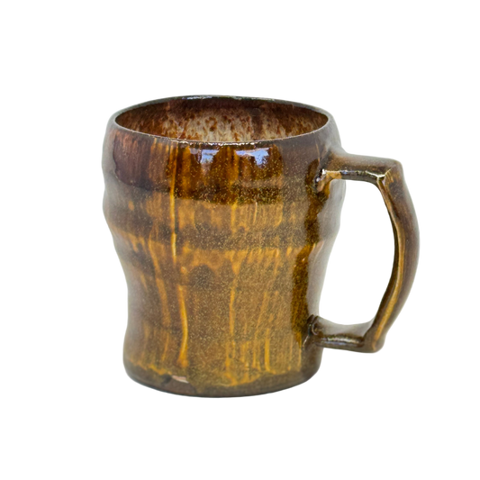 Brown ceramic mug on a white background