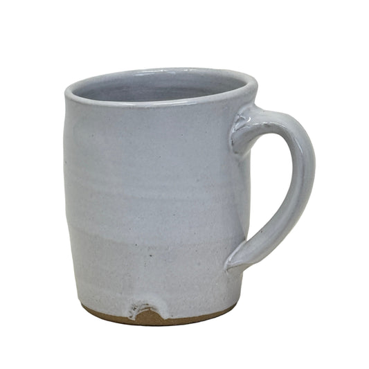 Gray ceramic mug with a handle on a white background