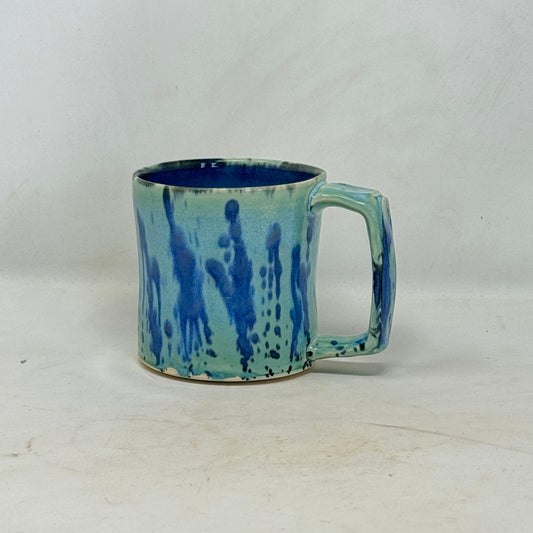 Blue ceramic mug on a white background