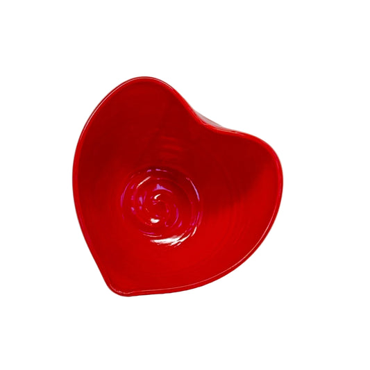 Red heart-shaped bowl on a white background
