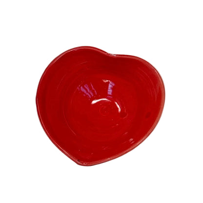 Red ceramic bowl on a white background